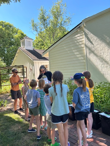 kids outdoors looking at presenter