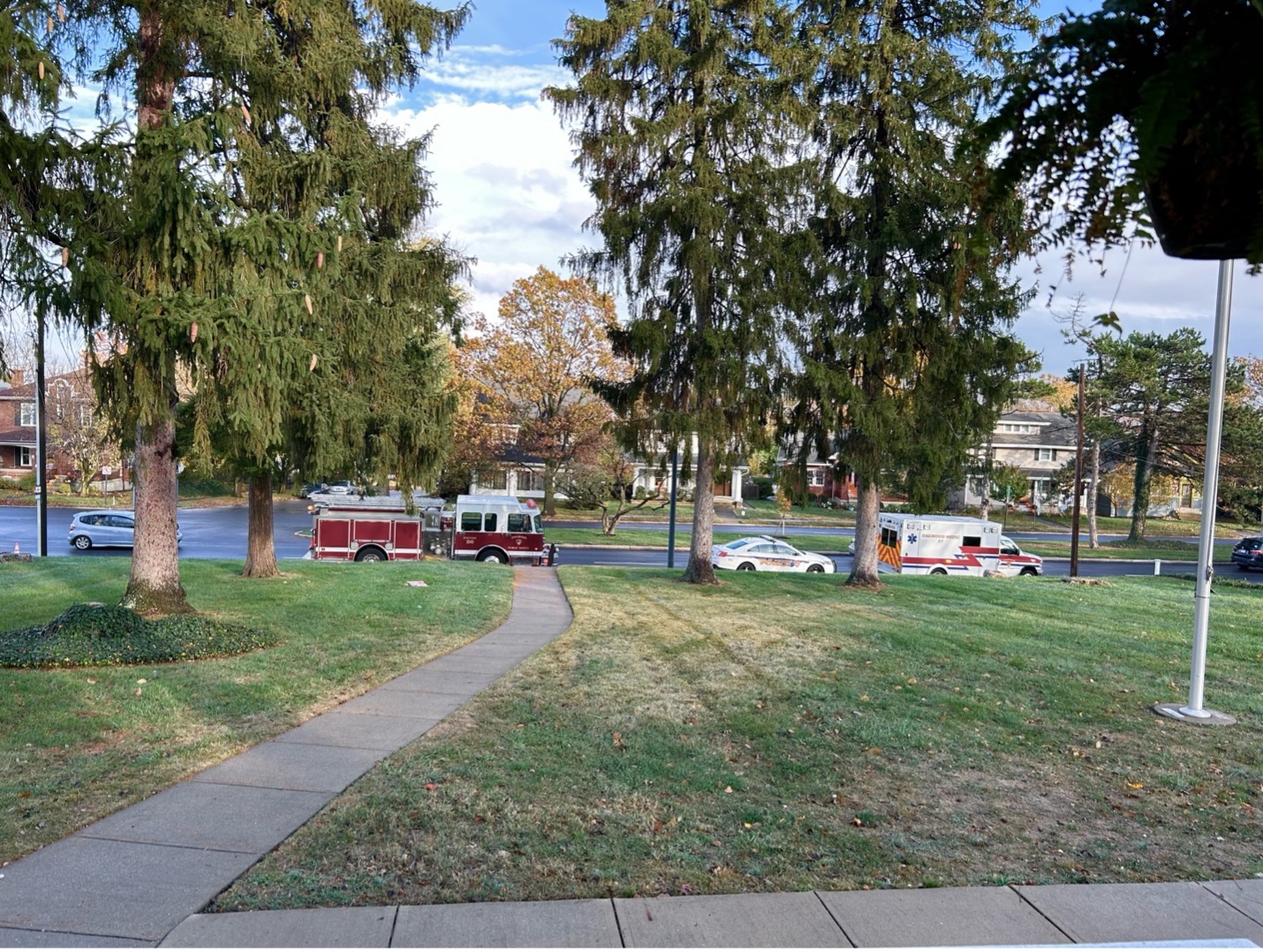 Public Safety vehicles on the street in front of the Long-Romspert Homestead